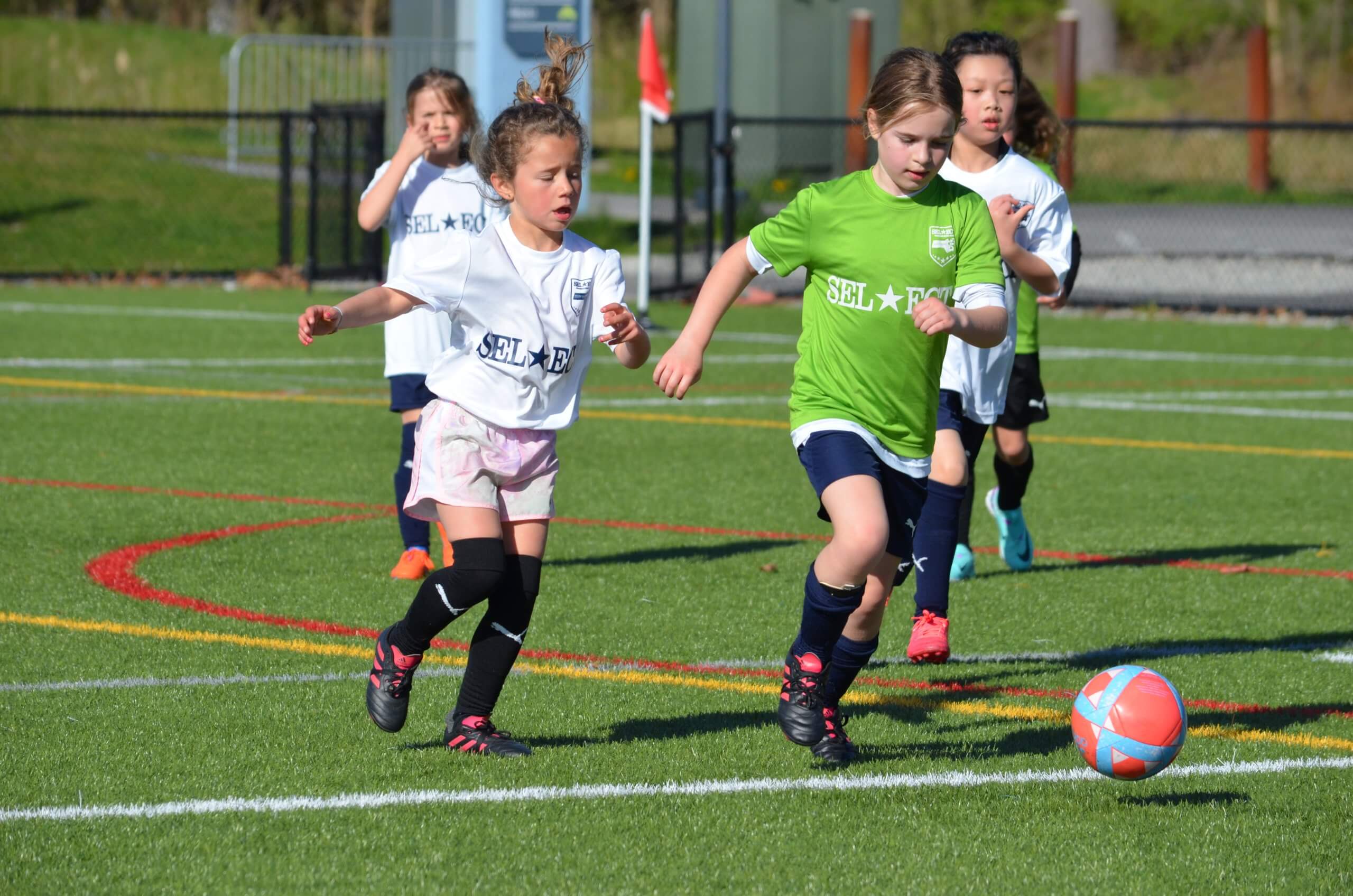 Young girls playing soccer